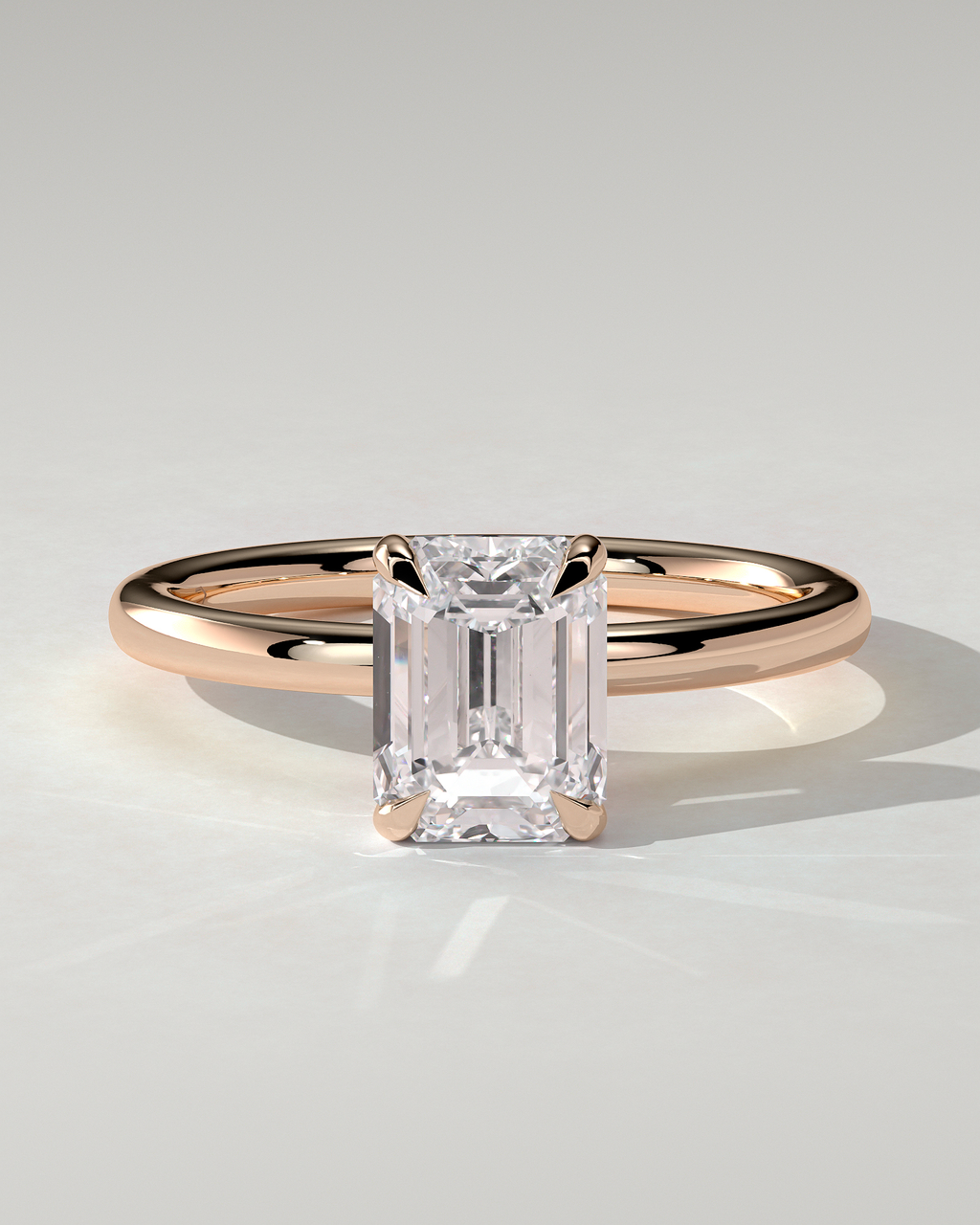 Alice Solitaire Emerald Ring
