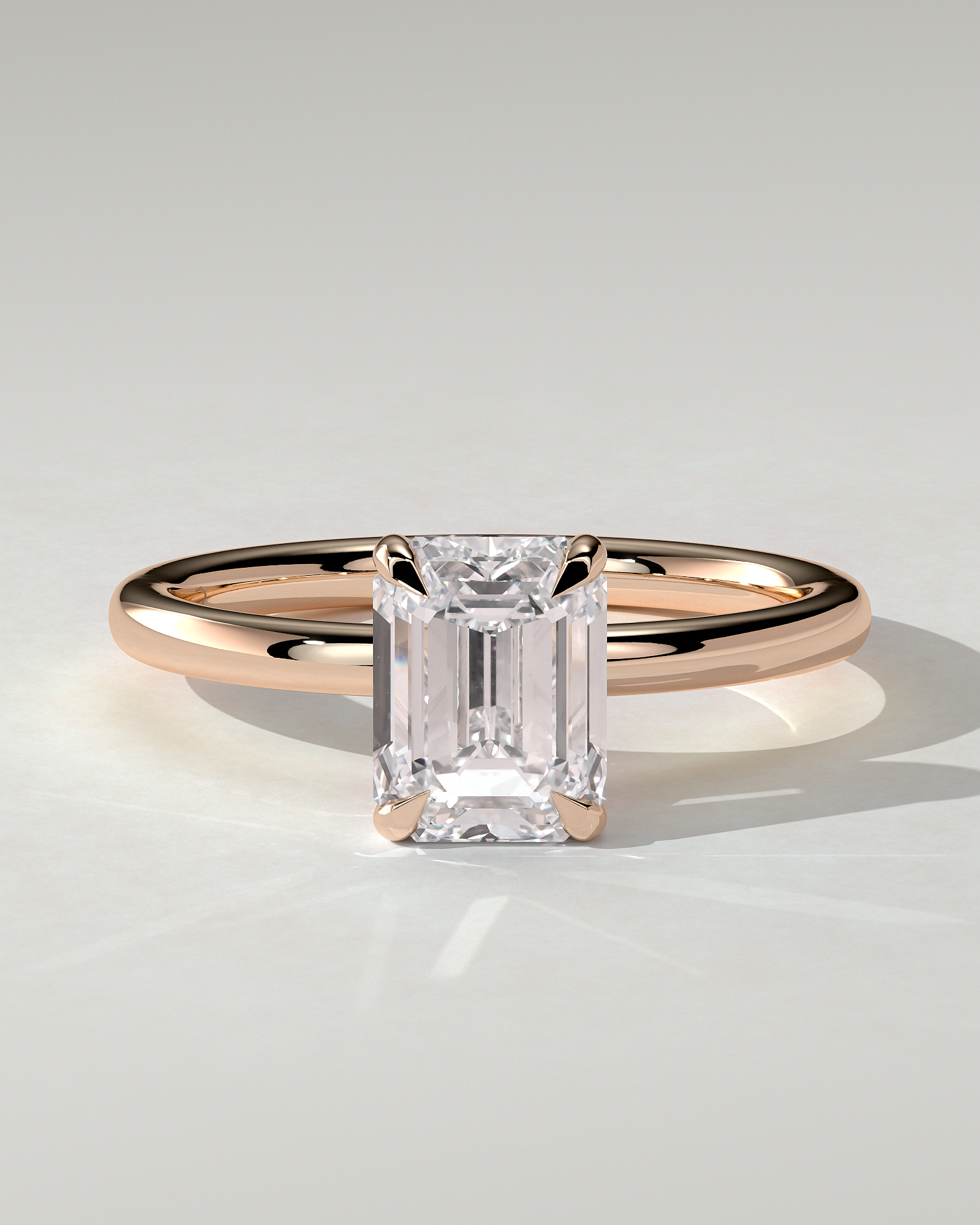 Alice Solitaire Emerald Ring