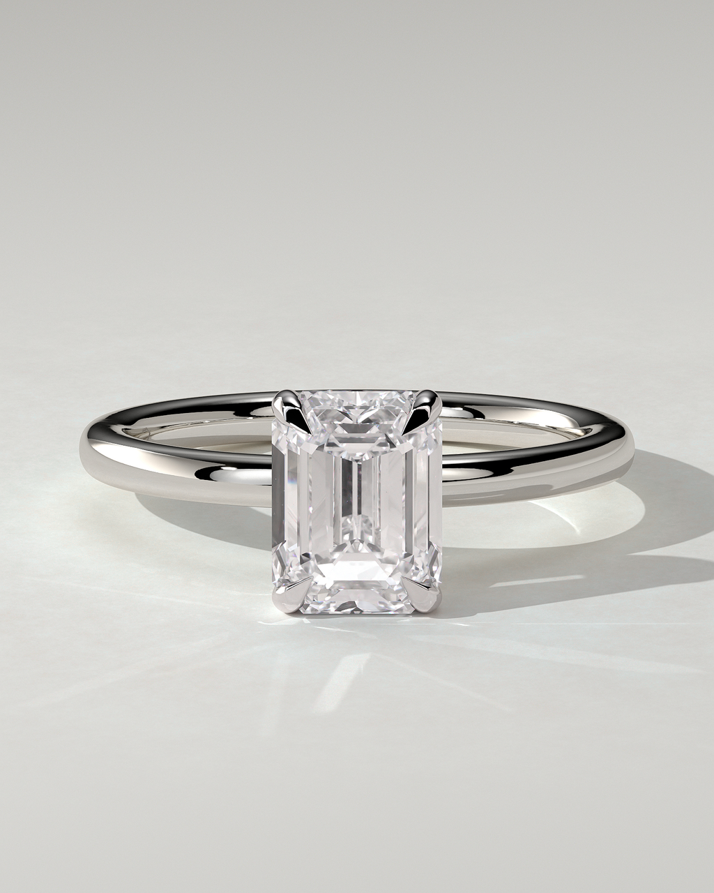 Alice Solitaire Emerald Ring