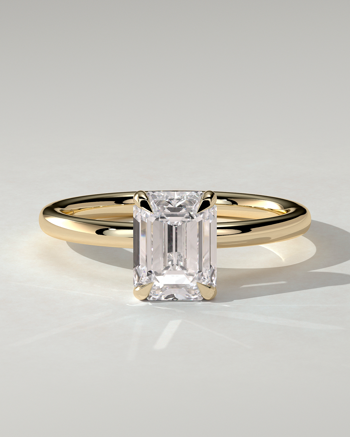 Alice Solitaire Emerald Ring