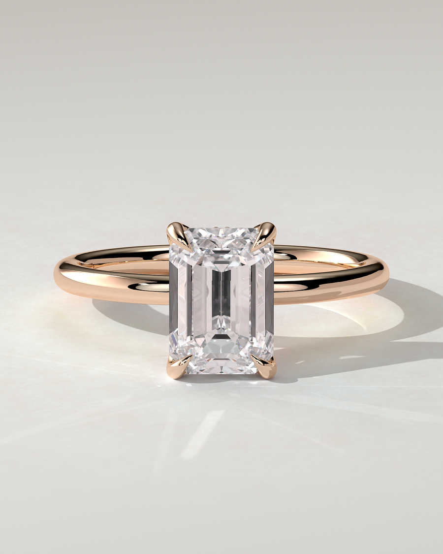Freesia Solitaire Emerald Ring